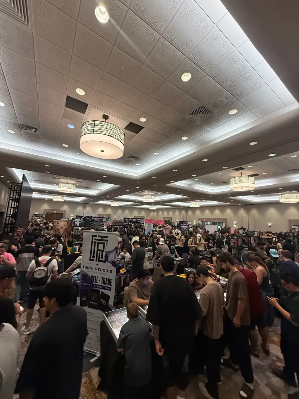 Hundreds of collectors filling the Arizona Ballroom show floor at The Cactus TCG Show free card show in Mesa, Arizona