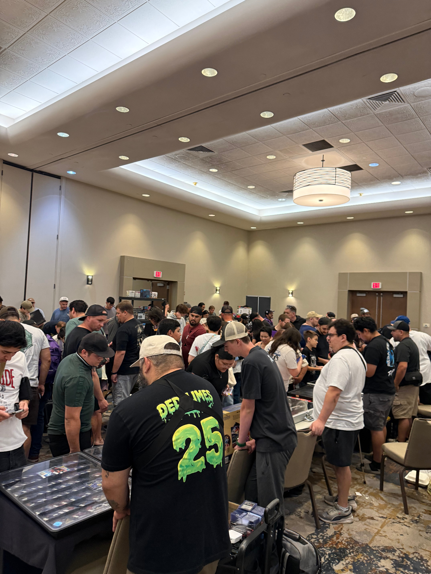 Wide crowd shot of collectors filling the Arizona ballroom card show floor