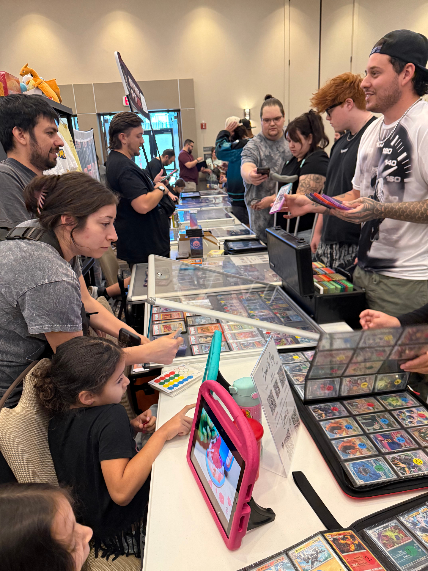 Collectors and families browsing dealer tables at The Cactus card show in Arizona